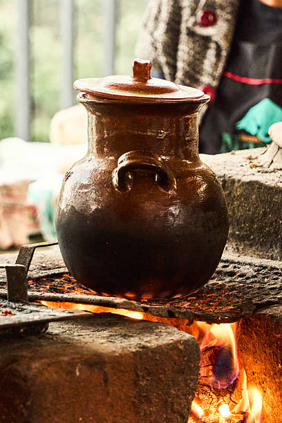 istock A large brown pot is sitting on a fire. Mexico, mexico city 2236282837