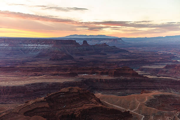 istock Sunset Over Vast Red Canyon Landscape With Rock Formations And Distant Plateaus 2236283080