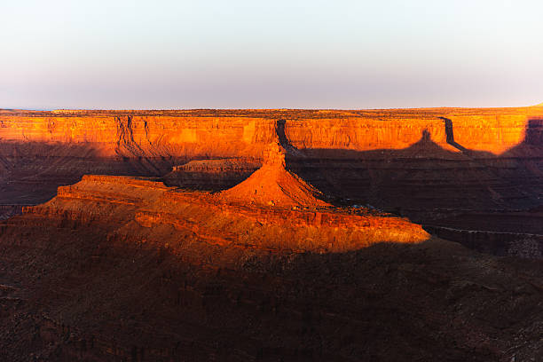 istock Sunrise Over Grand Canyon: Dramatic Red Cliffs, Warm Light, and Expansive Desert Landscape 2236283151