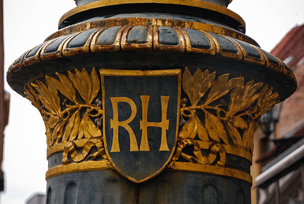 Zagreb, Croatia - August 31, 2012 - Ornate metal column with golden rh emblem and decorative design.