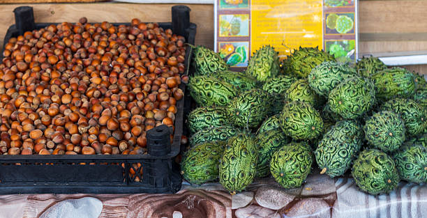 Kiwano melons and chestnuts on display of the farmers stall.