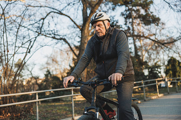 istock Old Man Cycling in Park 2236290062