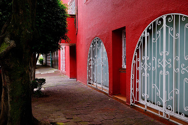 istock Red Building with White Arched Windows on Peaceful Street (Mexico City, CDMX, Mexico) 2236292056