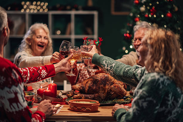 istock Happy family toasting during christmas dinner celebration at home 2236292680