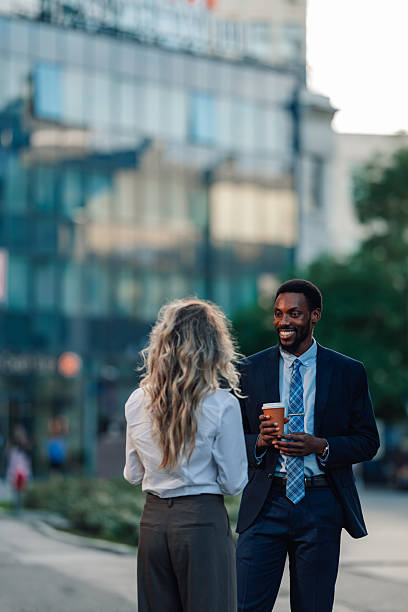 istock Business colleagues having coffee break conversation outdoors 2236293587