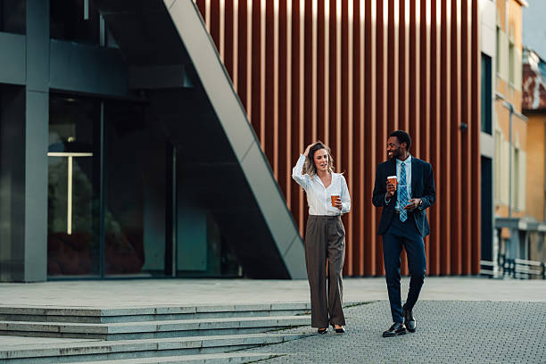 istock Diverse business colleagues walking and talking during coffee break 2236293644