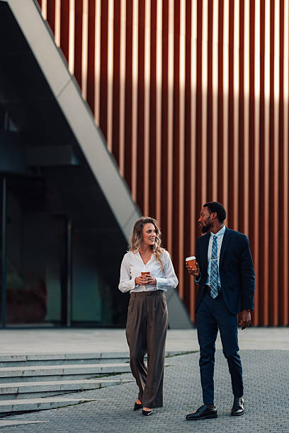 istock Diverse business colleagues walking and talking during coffee break 2236293660