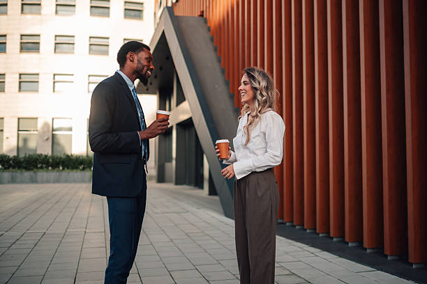 istock Business colleagues talking during coffee break in city 2236293670