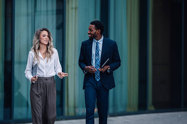 istock Diverse business professionals walking and talking outdoors 2236293774