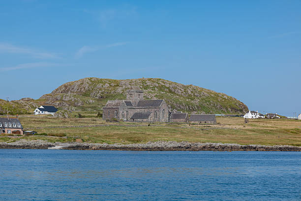 Tranquil shoreline of Iona with Monastry in the background
