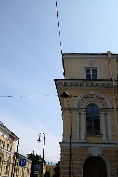 istock Sunlight shines on a historic building under a clear sky in an urban setting, highlighting architectural details and street elements 2236304021
