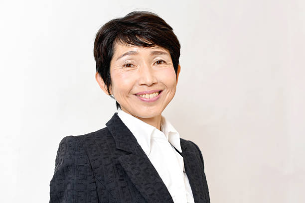 istock Middle-aged business woman in a suit 2236308495