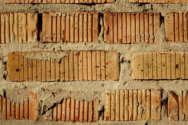 Striped red brick wall close up photo, detailed background photo texture