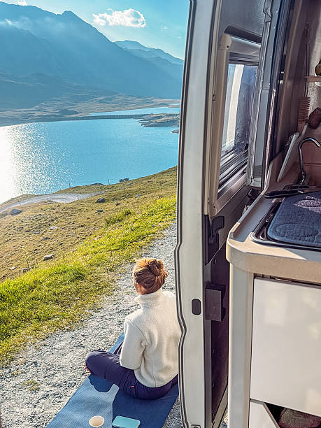 istock Woman Meditating Outdoors Near Camper Van 2236313345