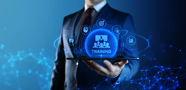 istock Businessman Holding tablet with Training Icons on Screen. E-Learning and online Education concept 2236313590