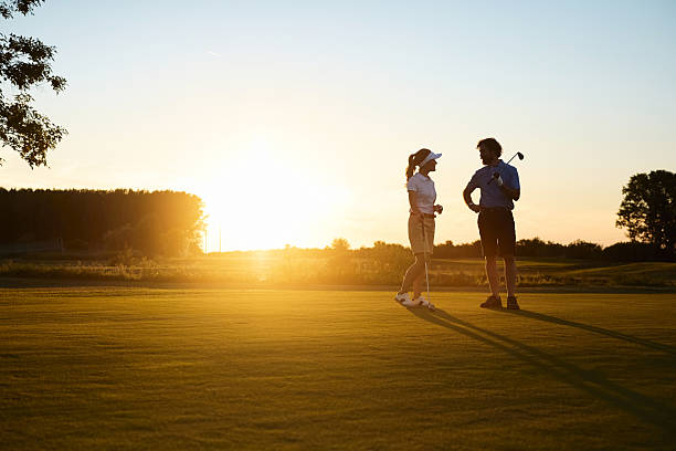 Four friends on golf course.