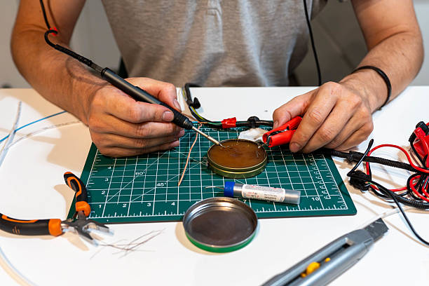 Close-up of soldering process with iron, wires, and flux, symbolizing electronics DIY, hobby repair, and technical craftsmanship.