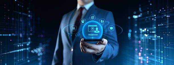 istock Businessman Holding Smartphone with Webinar Icons on Screen. E-learning and Education Concept 2236315938