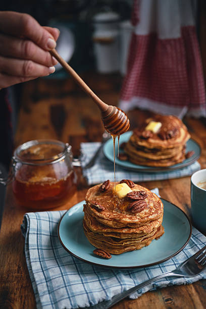 istock Stack of Sweet Potato Pancakes with Butter and Pecan Nuts 2236316026