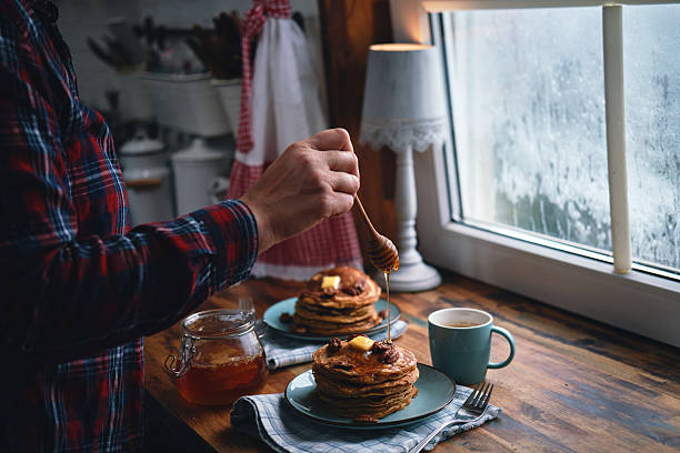 Stack of Sweet Potato Pancakes with Butter and Pecan Nuts