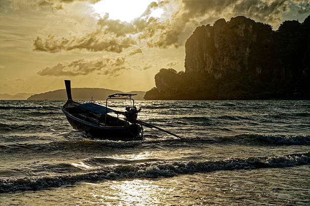 Fisherman boat on Railay beach at sunset, Thailand