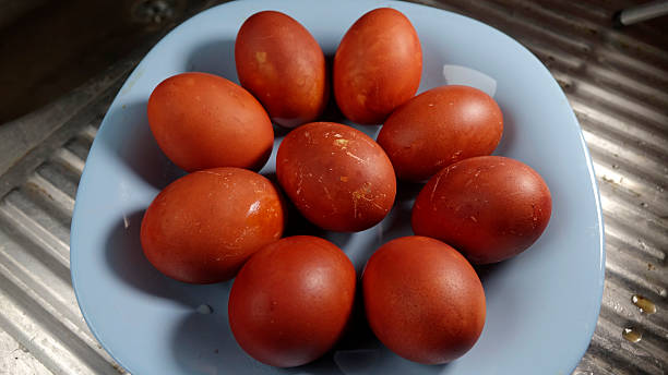 Red Easter Eggs on a Blue Plate, Celebrating the Essence of Spring