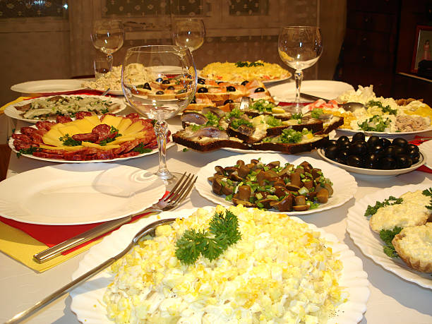 istock Festive Table Spread With Sandwiches, Salads, and Wine Glasses for a Celebration 2236319545