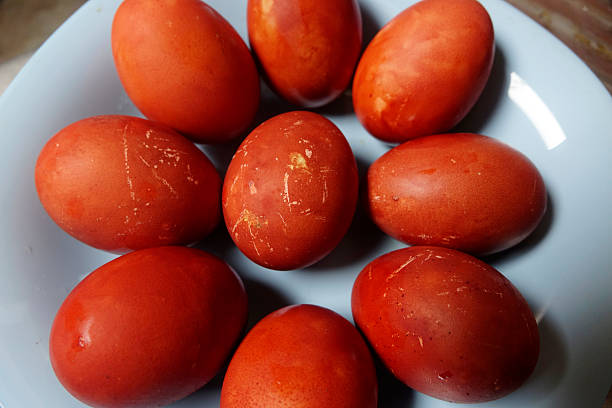 istock Plate is filled with numerous red Easter eggs with natural red-brown color and textured eggshells 2236320208