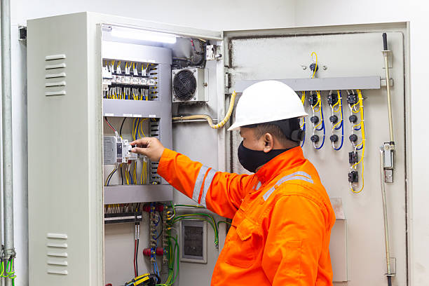 istock Electrical Engineer Inspecting Distribution Board Wearing Protective Gear at Worksite Ensuring Safety and System Reliability, Concentrating on High Voltage Panel Control Equipment 2236324782
