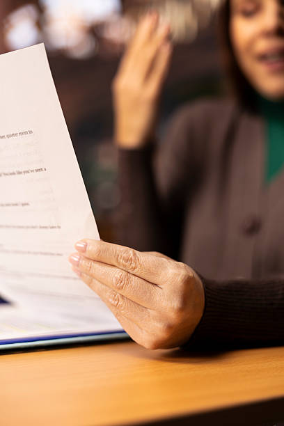 istock Mature woman focused on university level reading and studying 2236326023