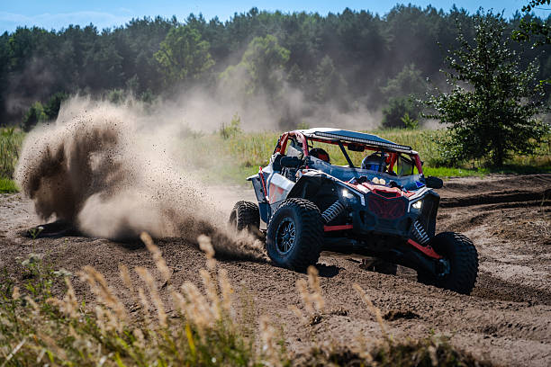 istock Cool view on UTV, rally, 4x4 riding in dusty track. Amateur competitions 2236326485