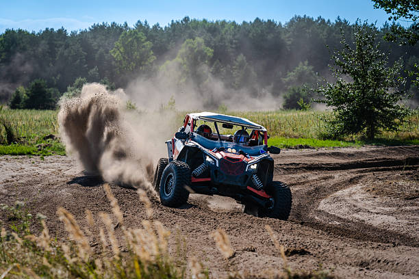 istock Cool view on UTV, rally, 4x4 riding in dusty track. Amateur competitions 2236327328