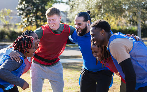 istock Multiracial group of adults playing sport, in huddle 2236330931