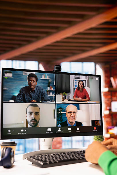 istock Remote worker looking at PC monitor discussing with coworkers during videocall 2236331005