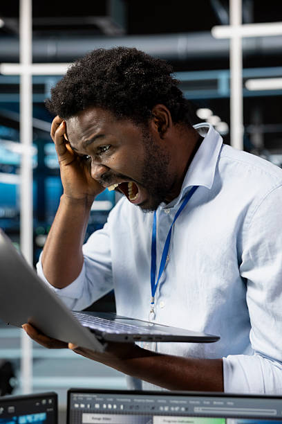 Upset server room technician screaming after mistakenly deleting data backups