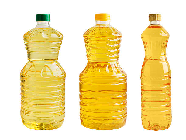istock Vegetable oil in bottle isolated on white background. 2236339323