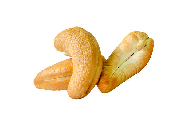 istock Roasted peeled cashew nuts in stack isolated on white background with clipping path 2236340624