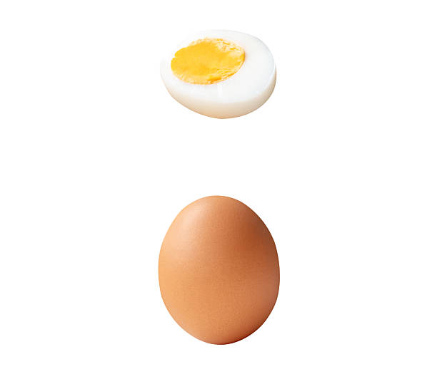istock Top view set of raw brown chicken egg and cooked or boiled chicken egg with egg yolk in half isolated on white background with clipping path 2236341304