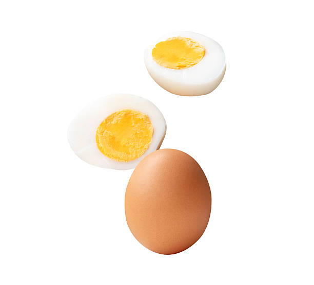 istock Top view set of raw brown chicken egg and cooked or boiled chicken egg with egg yolk in two halves isolated on white background with clipping path 2236341312