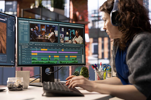 Woman video creator working on editing a movie montage project
