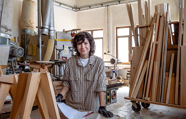 istock Confident Female Carpenter Standing In Sunlit Workshop With Professional Woodworking Equipment And Materials 2236342901