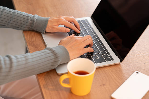 istock asian woman who using laptop, hands 2236345182