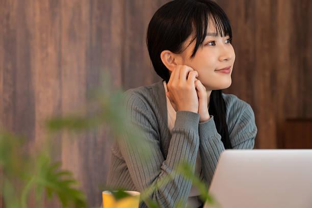 istock asian woman who using laptop 2236345204