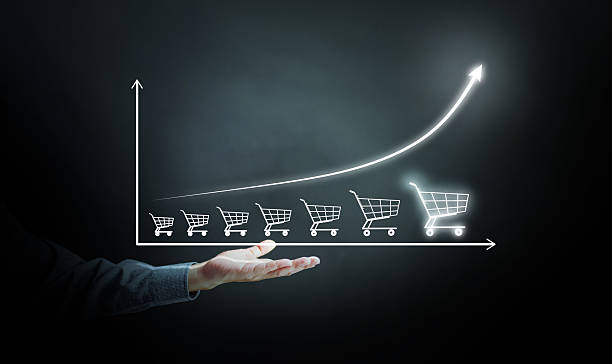 istock E-commerce growth concept with shopping cart graph and rising sales chart, symbolizing online business success, digital marketing strategy, and increasing consumer demand. 2236348083