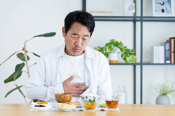 istock Middle-aged man with poor appetite at breakfast 2236351523
