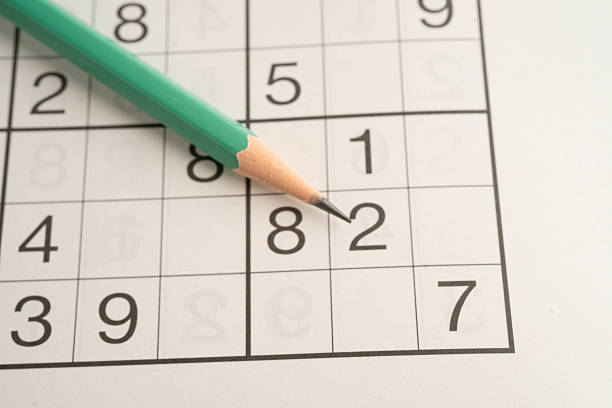 istock Sudoku puzzle, game to play for keep you brain younger for developing Alzheimer disease in senior patient. 2236351865