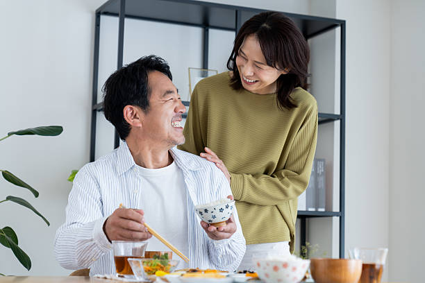 istock Middle-aged couple having breakfast at home 2236352611