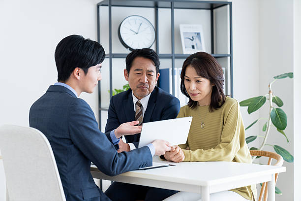 istock A middle-aged couple consulting with a businessman 2236352894