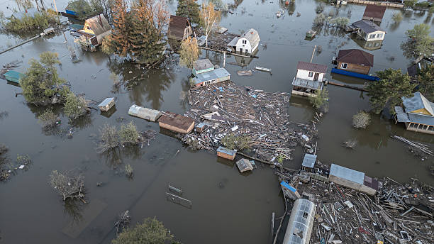 istock Global warming,climate change.Tsunami.Storms and destruction.Floods on the planet.The apocalypse, catastrophes.Natural disasters the riot.The remnants of human life are floating in dirty water.The end 2236353563