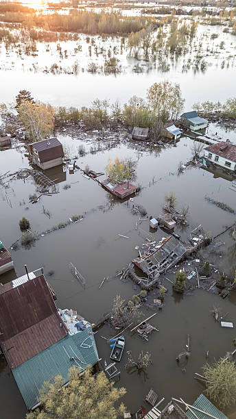 istock Global warming,climate change.Tsunami.Storms and destruction.Floods on the planet.The apocalypse, catastrophes.Natural disasters the riot.The remnants of human life are floating in dirty water.The end 2236353579